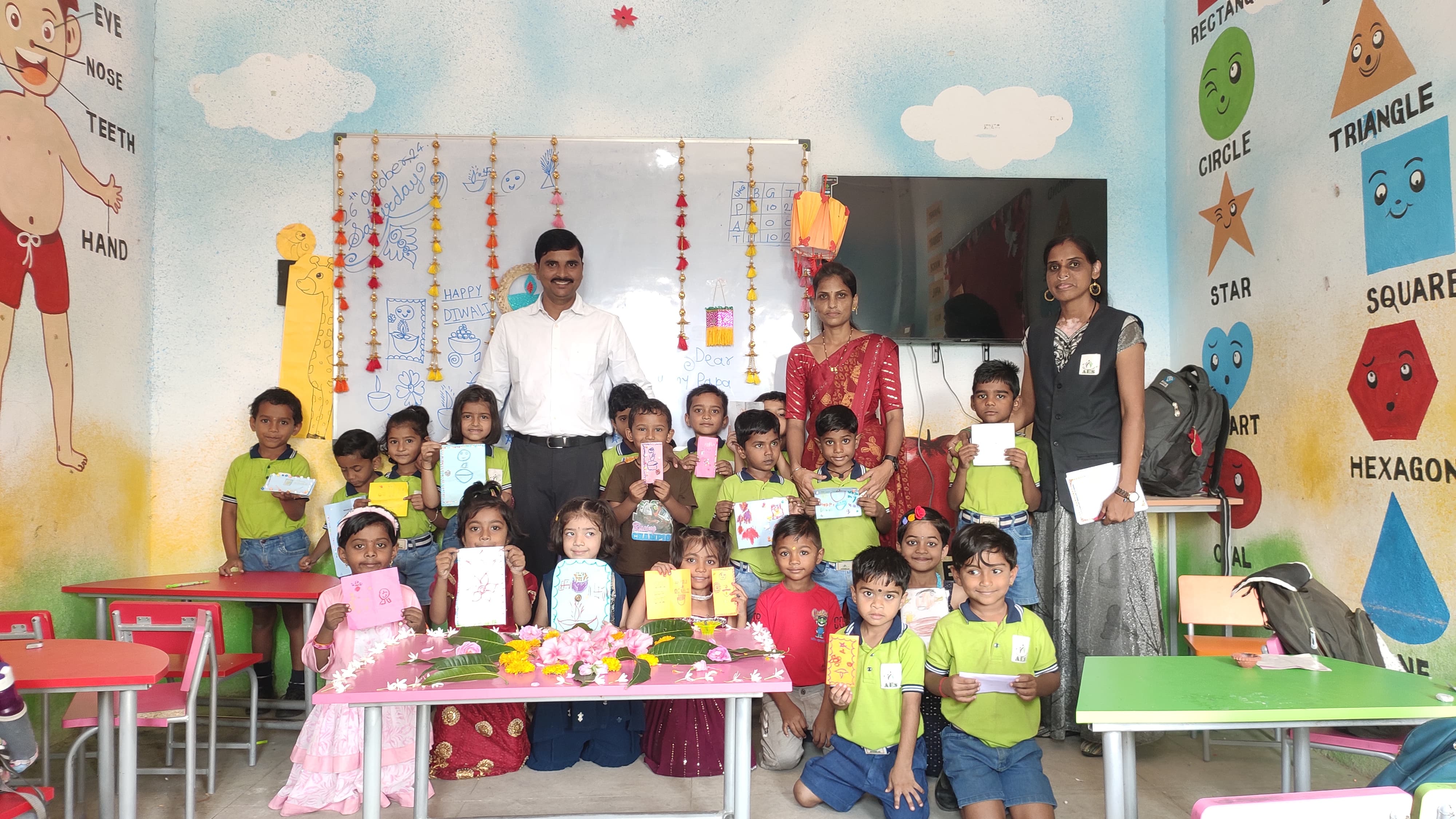 Students making lanterns and diyas for Diwali